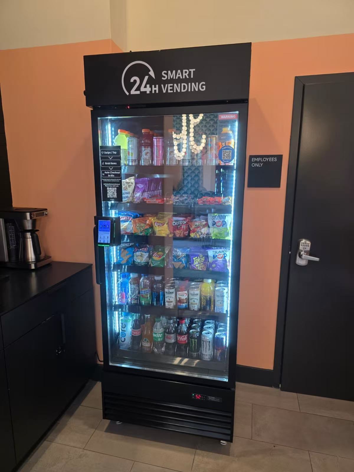 Single smart vending cooler stocked in an office area